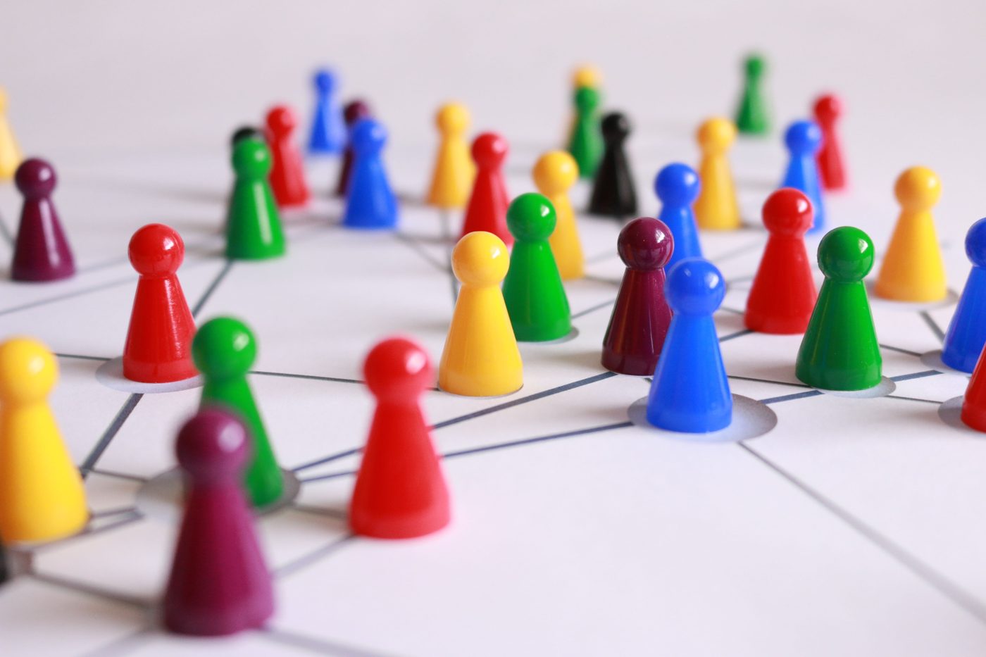 Colourful game pieces connected as a network